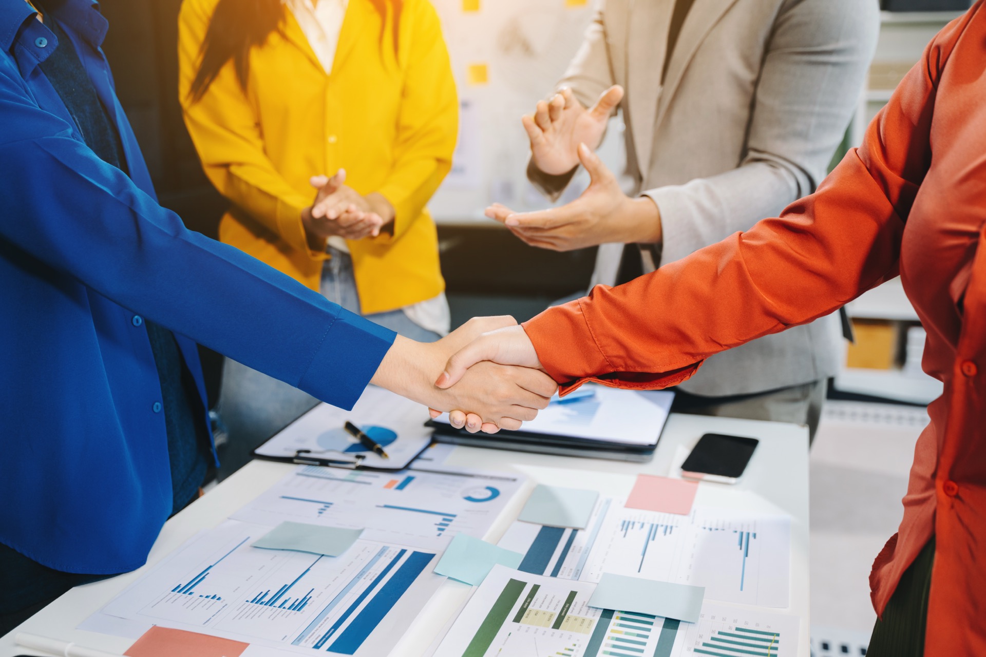 Business professionals shaking hands